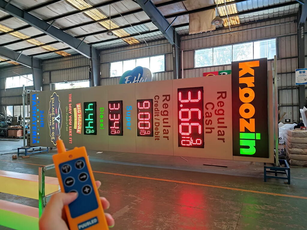 Gas station pylon sign with illuminated logo and LED price display, designed for high roadside visibility and complete fuel station branding.