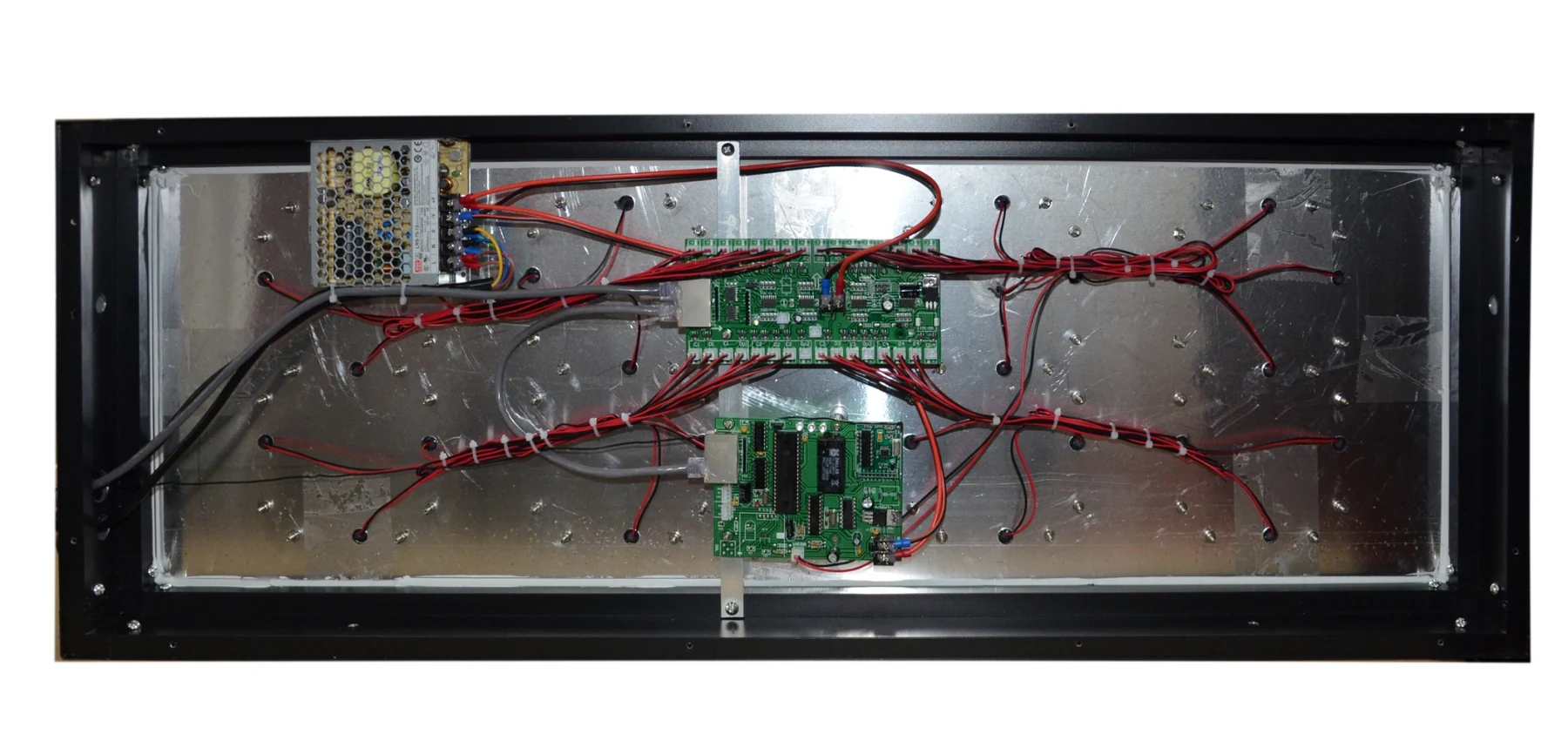 Internal components of LED gas price sign including LED modules control board and power supply