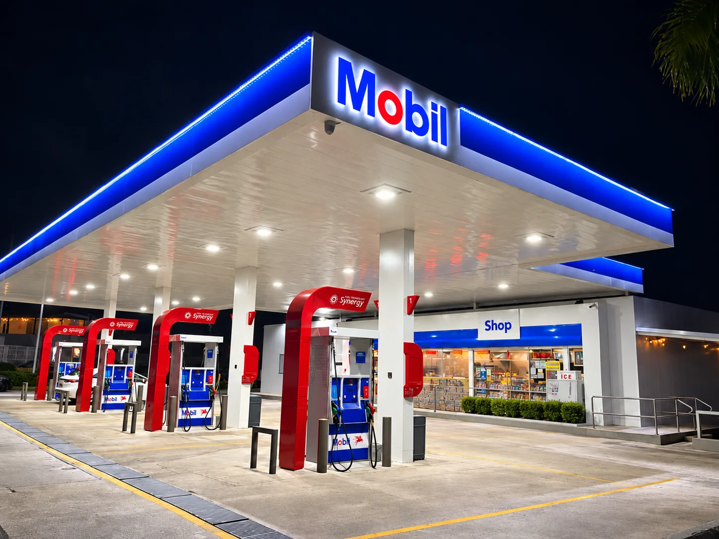 Illuminated gas station canopy fascia at night