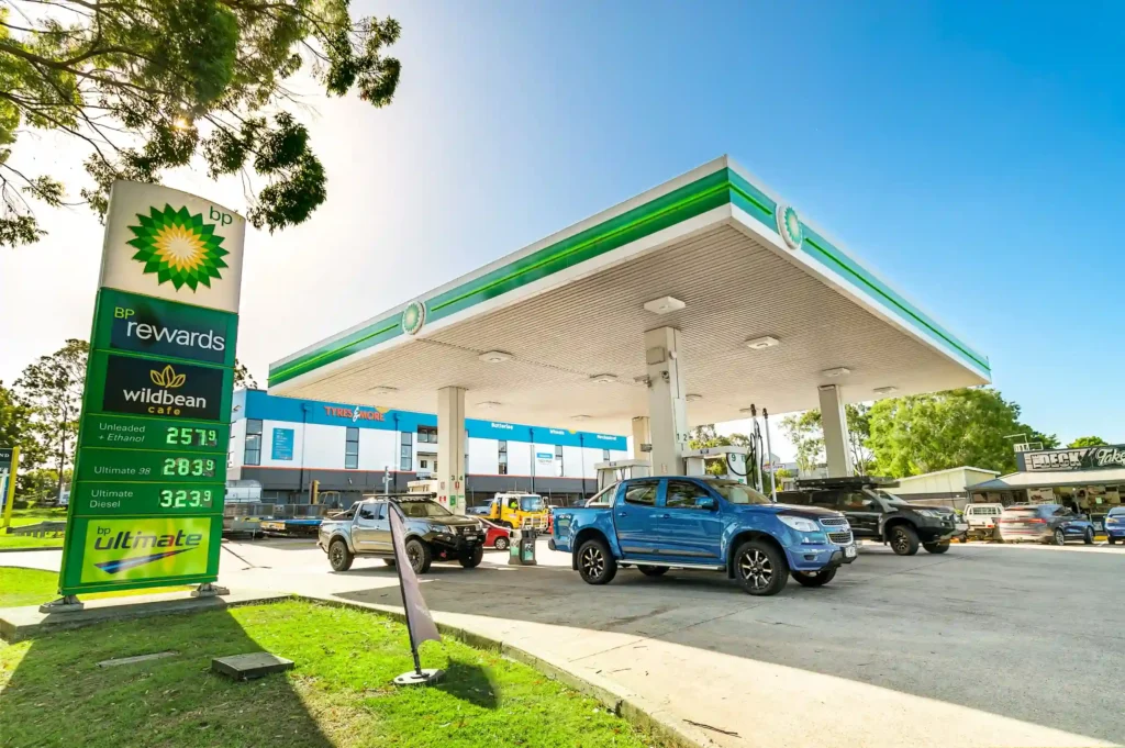 Gas station canopy design with pylon sign and LED price display