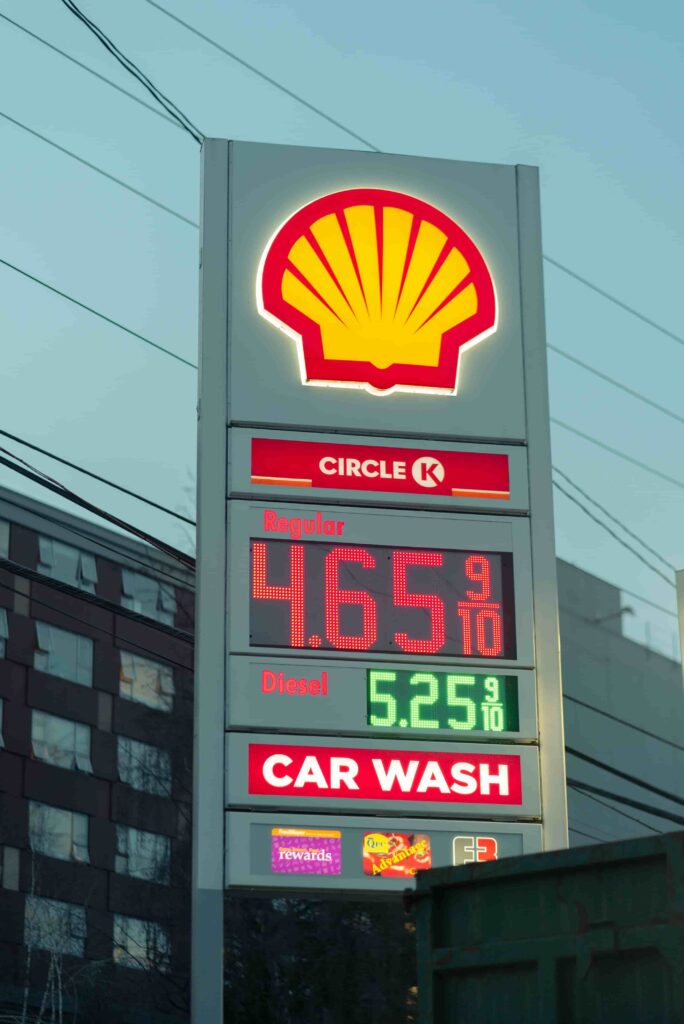 Fuel station branding system with canopy pylon sign and LED gas price display