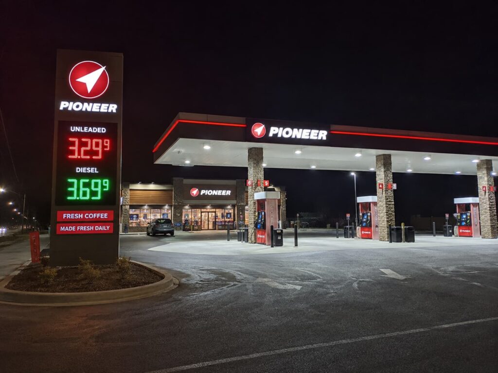 integrated fuel station branding with canopy sign pylon sign and LED price signs