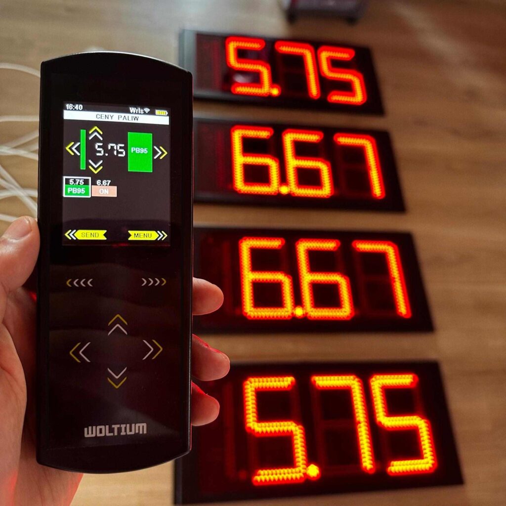 Handheld controller updating LED fuel prices on a gas price display