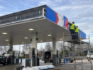 TA fuel station canopy fascia installation during signage redesign